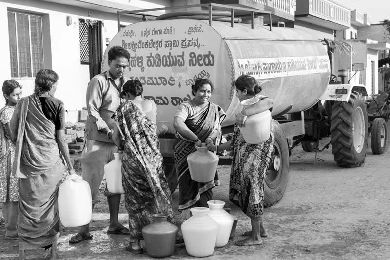 Human Right to Water in India - Buying potable water from a tanker in a salinity and fluoride-affected suburb of Kolar city, Karnataka